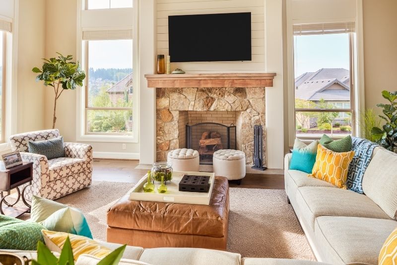 Residential furnished living room with two window on each side that has been cleaned by our team