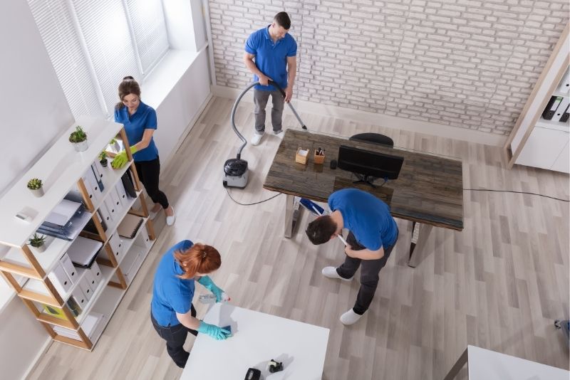 Cleaners cleaning an office